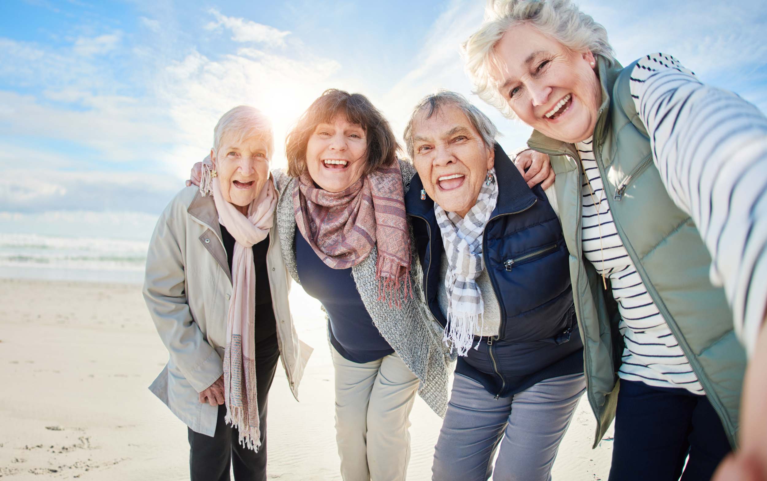 a group of older women smiling