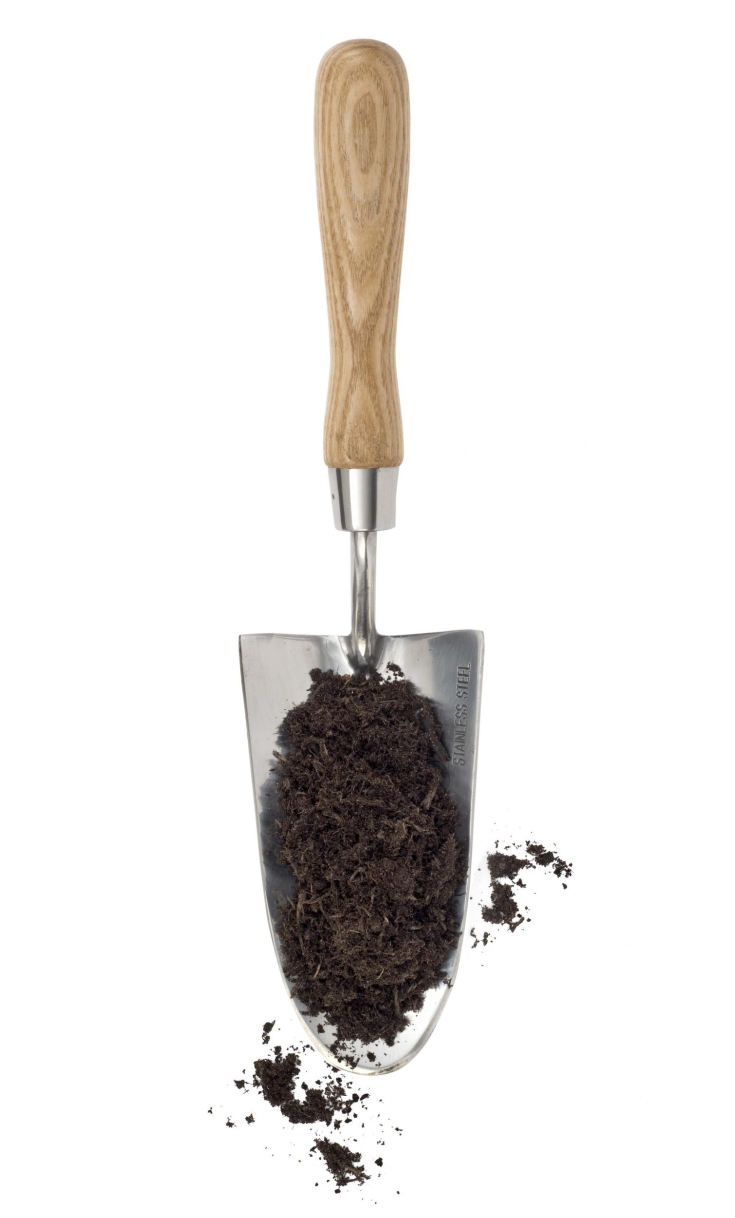 a small garden shovel with soil