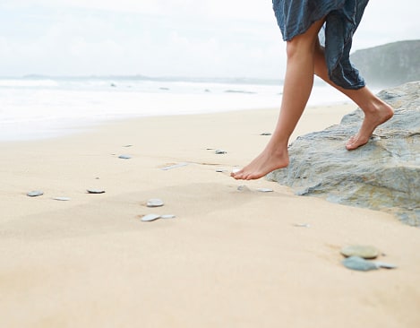 Stepping onto an untouched beach.