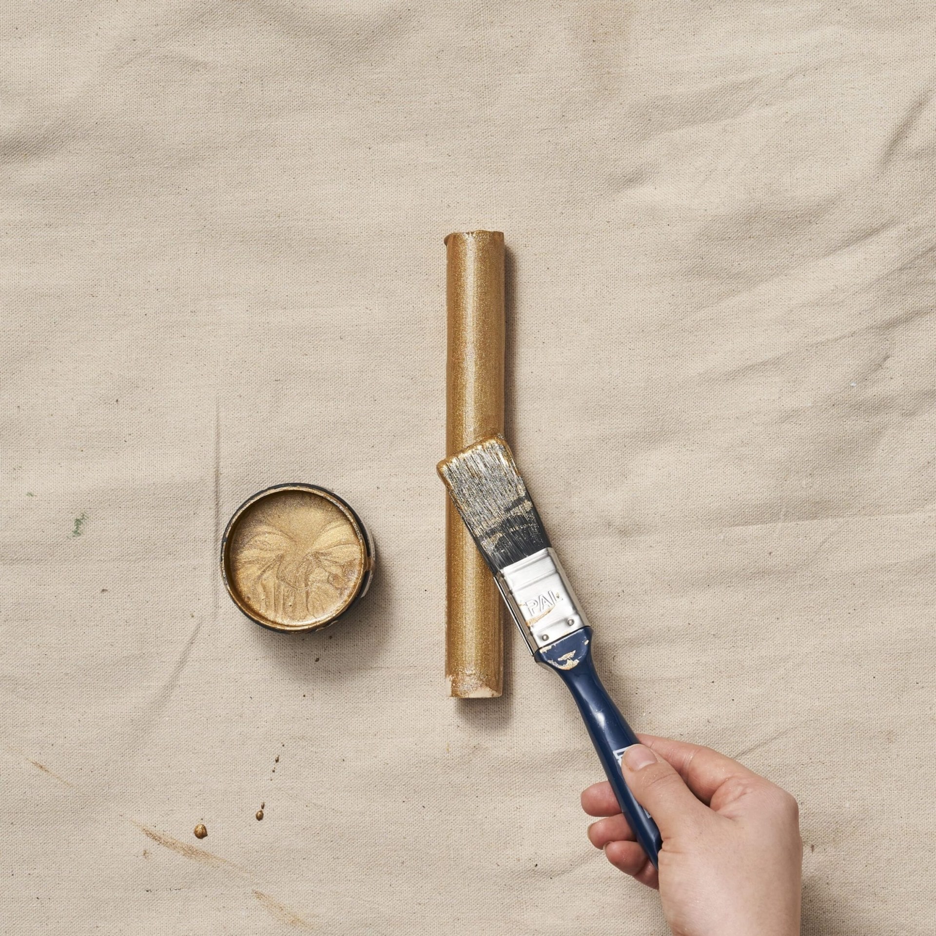 gold paint on wooden dowels