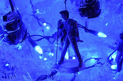 A white artificial tree, adorned with blue lights and Elvis Presley ornaments.Rick and Julie Angstadt transform their home each December, celebrating Christmas with a complete first floor re-decoration of their Exeter home. Berks Country Floor Plan Photo by Jeremy Drey 12/17/2013 (Photo By Harold Hoch/MediaNews Group/Reading Eagle via Getty Images)