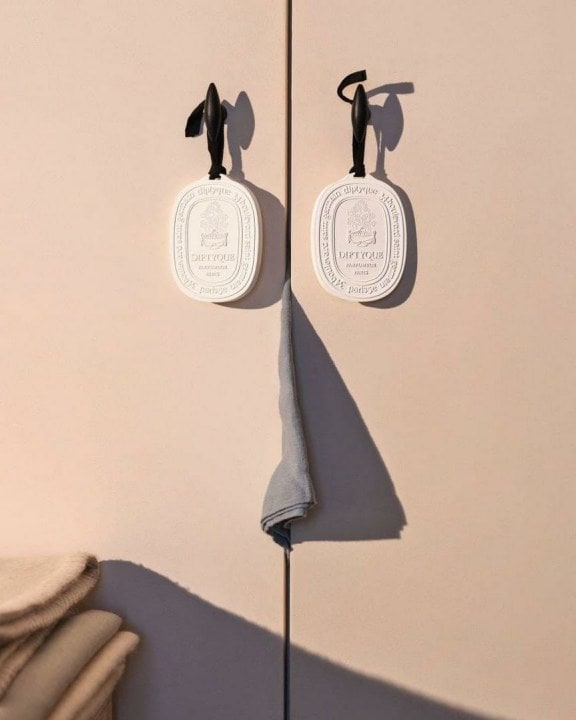 The Diptyque Scented Ovals handing from hooks- they are a great room fragrance idea. 