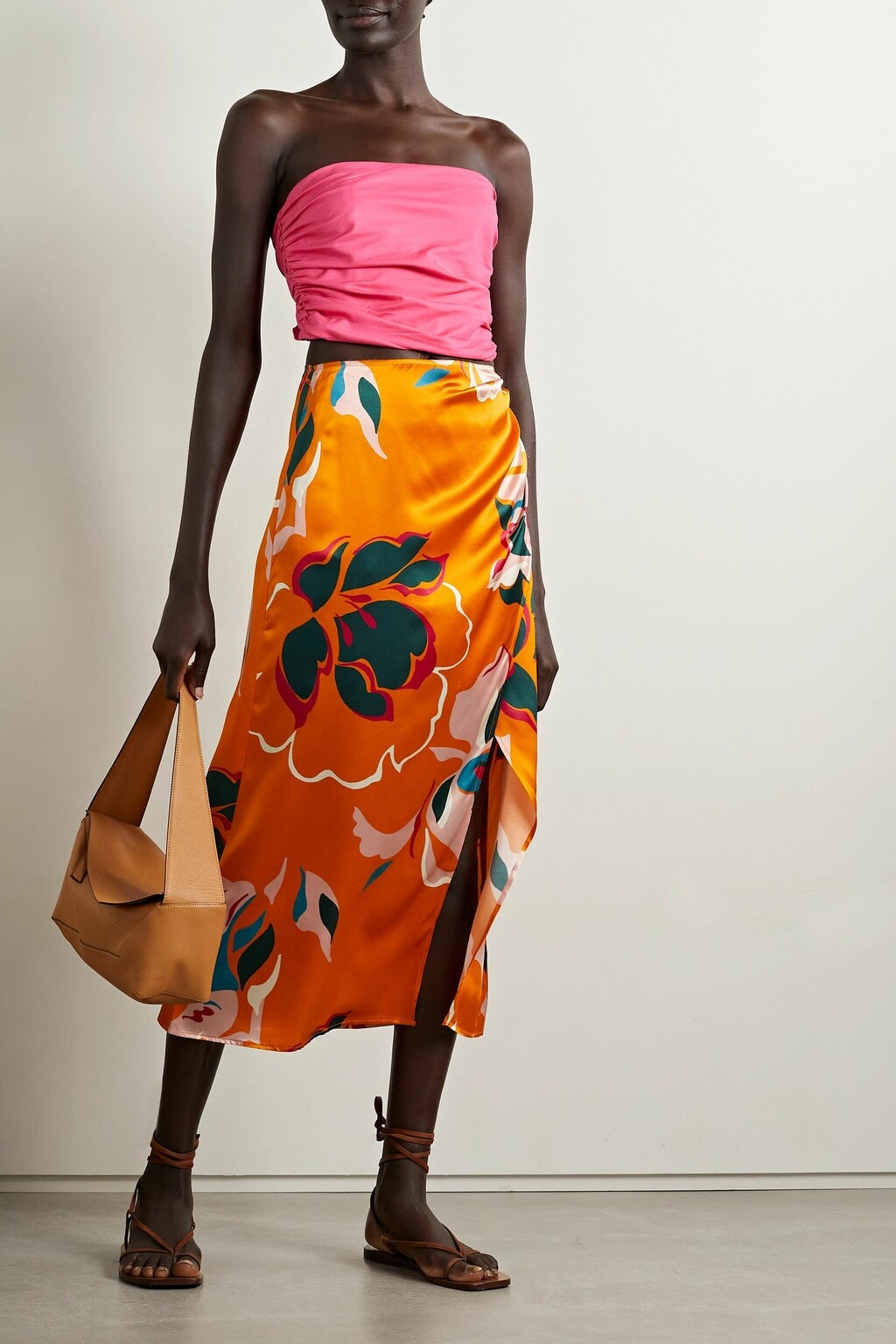 Reformation Arella Strapless Ruched Top is bright pink and summer wedding ready.