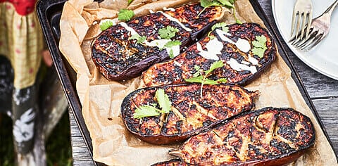 Baking tray with sliced eggplant.