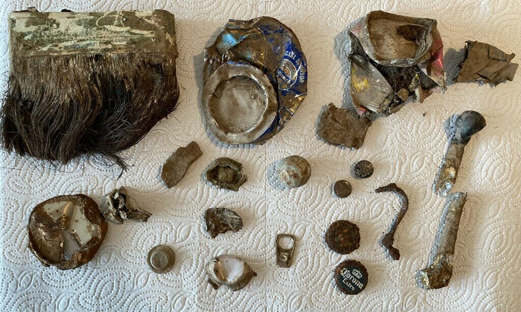 An array of rusty rubbish on a white paper towel.