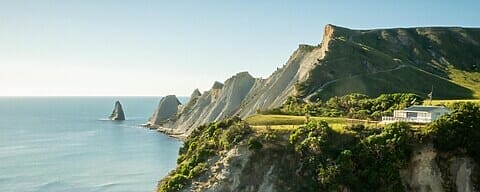 White House Build On The Cliff With Cape And Ocean In Background,Cape Kidnappers Trail, New Zealand