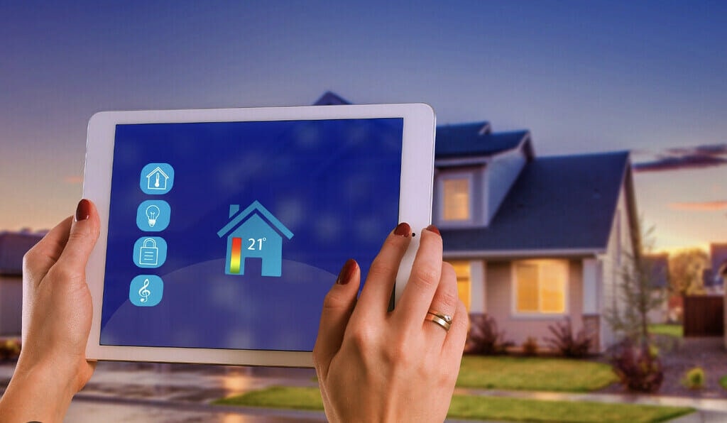 A woman controlling her home features with smart tech app. 