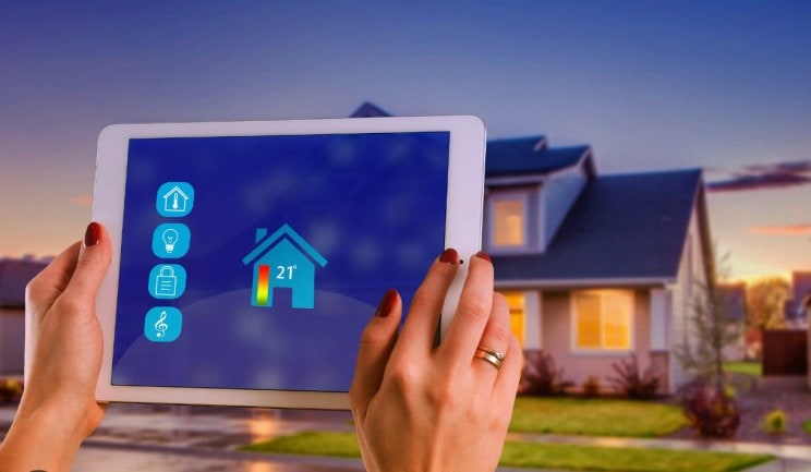 A woman controlling her home features with smart tech app. 