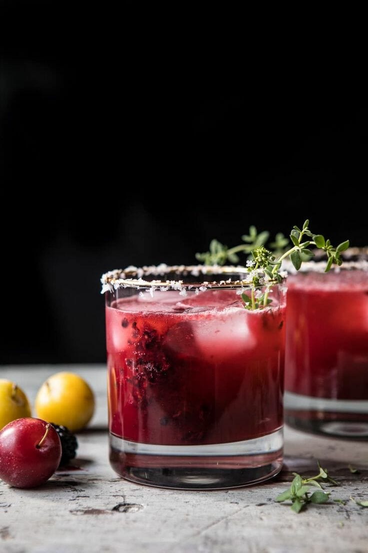 Black Plum & Cinnamon Margarita with fresh plum next to 2 glasses