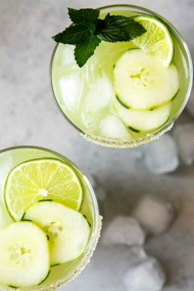 Cucumber Jalapeno Margarita in 2 glasses with garnishes
