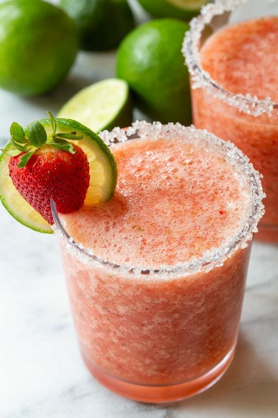 2 glasses of Frozen Strawberry Margarita with lime