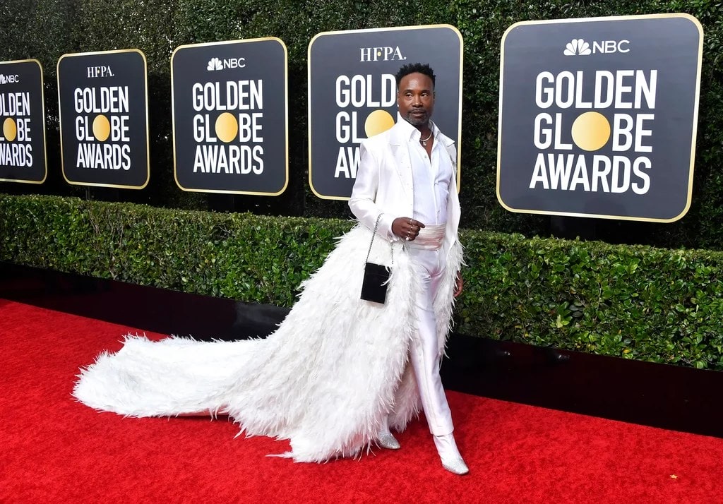 Billy Porter at the Golden Globe Awards in white feather outfit