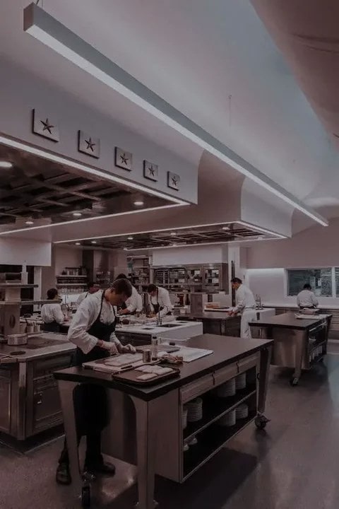 Young female chef kitchen 
