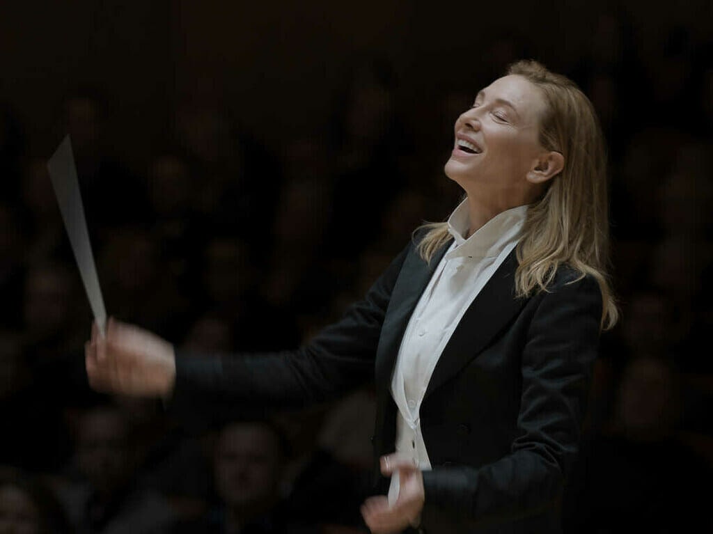 Women using a batton in Orchestra