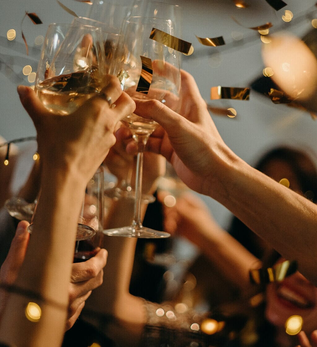 Confetti with wine glasses clinking
