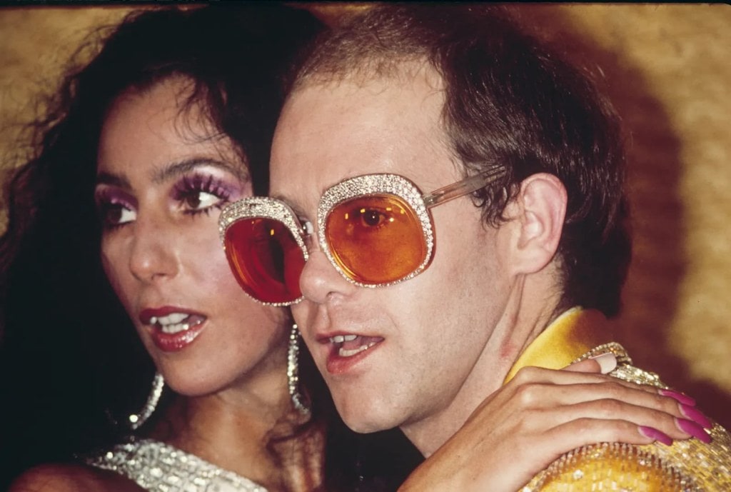 Young Elton John In Groovy Glasses Outfit Repetition