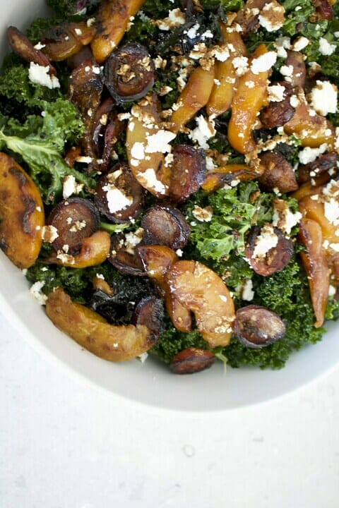 Grilled chorizo salad with slices of roasted peach and crumbled feta