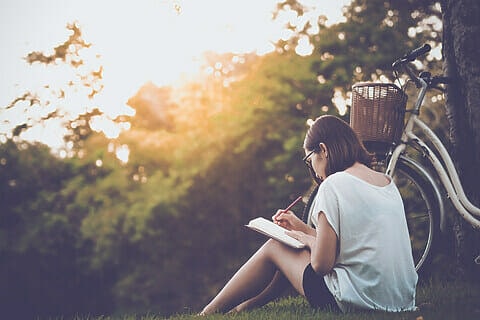 Women journaling in nature