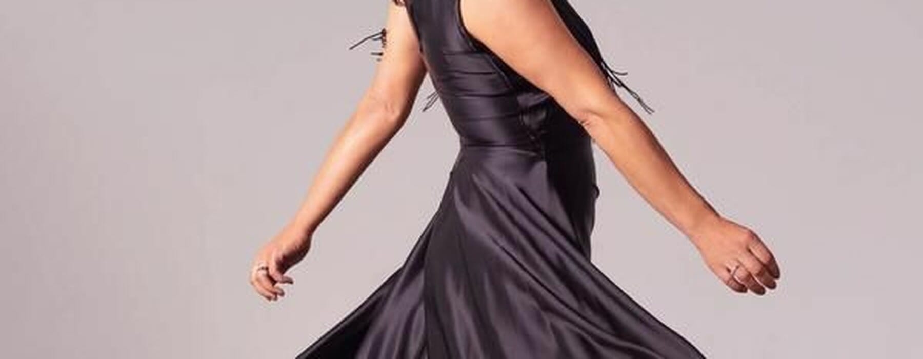 Stacey Morrison twirling in a dress