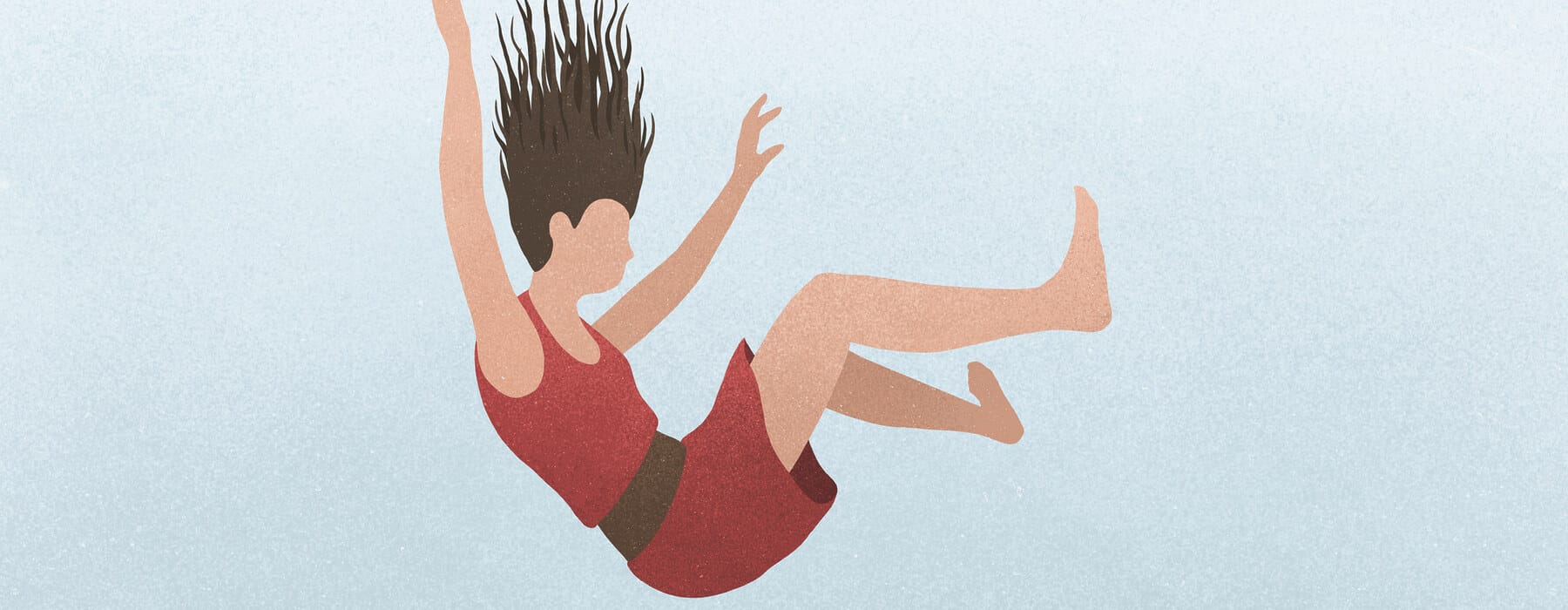 A woman falling against a blue background