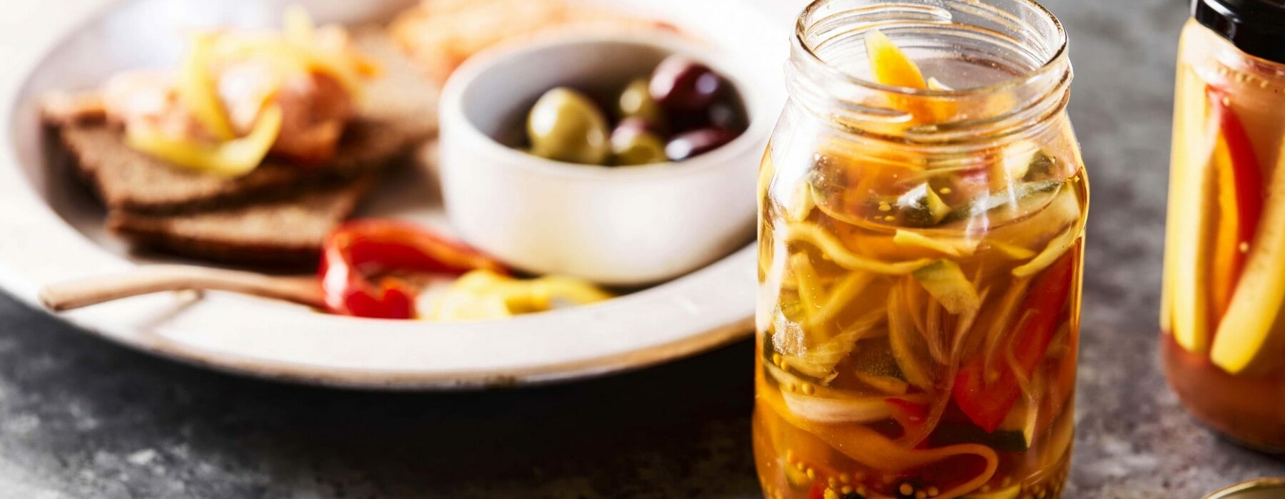 Preserved crunchy pickles in a jar