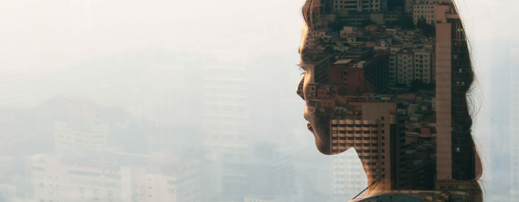 double exposure of woman looking at cityscape,shenzhen,china