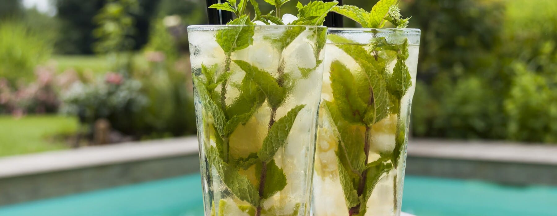 Two mojito cocktails on a table