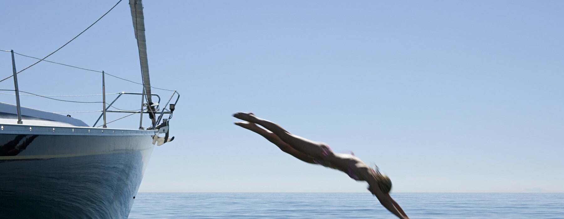Woman diving into ocean