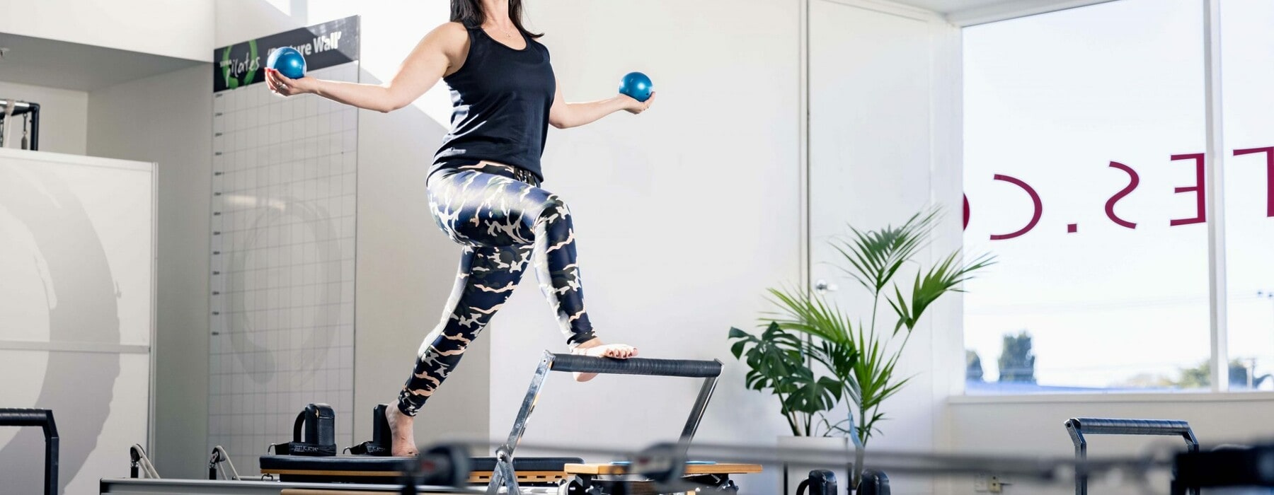 Claire Chitham in a reformer pilates studio