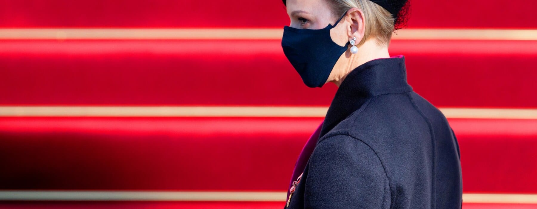 Princess Charlene of Monaco wearing black outfit and face mask