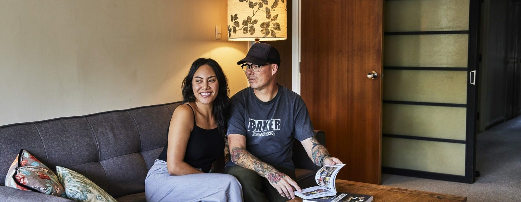 Olivia-and-Che-on-sofa-Breeze-On-In-scaled