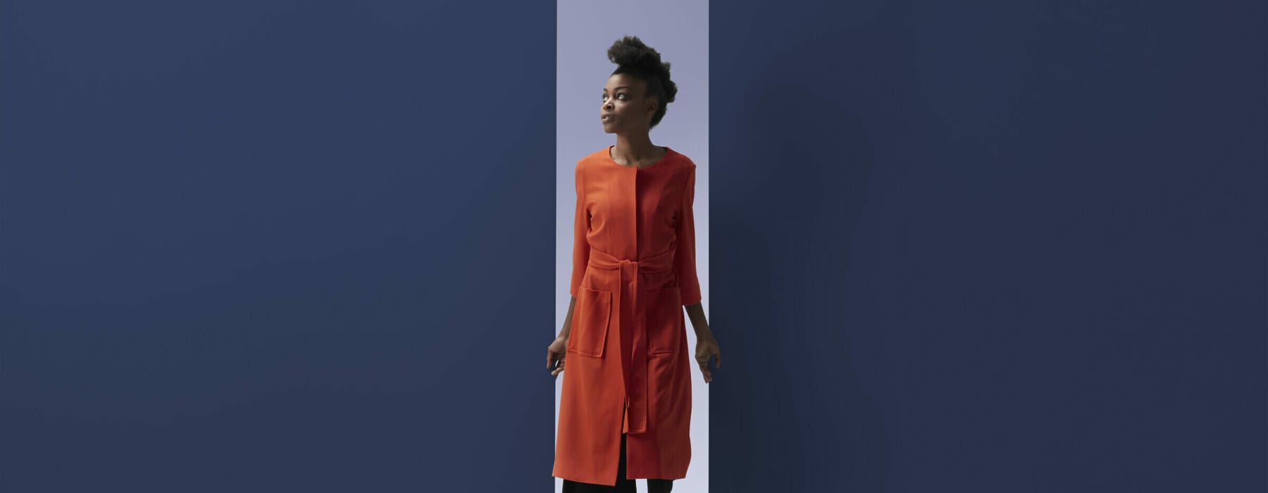 People moving threw portals in different shapes, in minimalistic studio setting in vivid colours