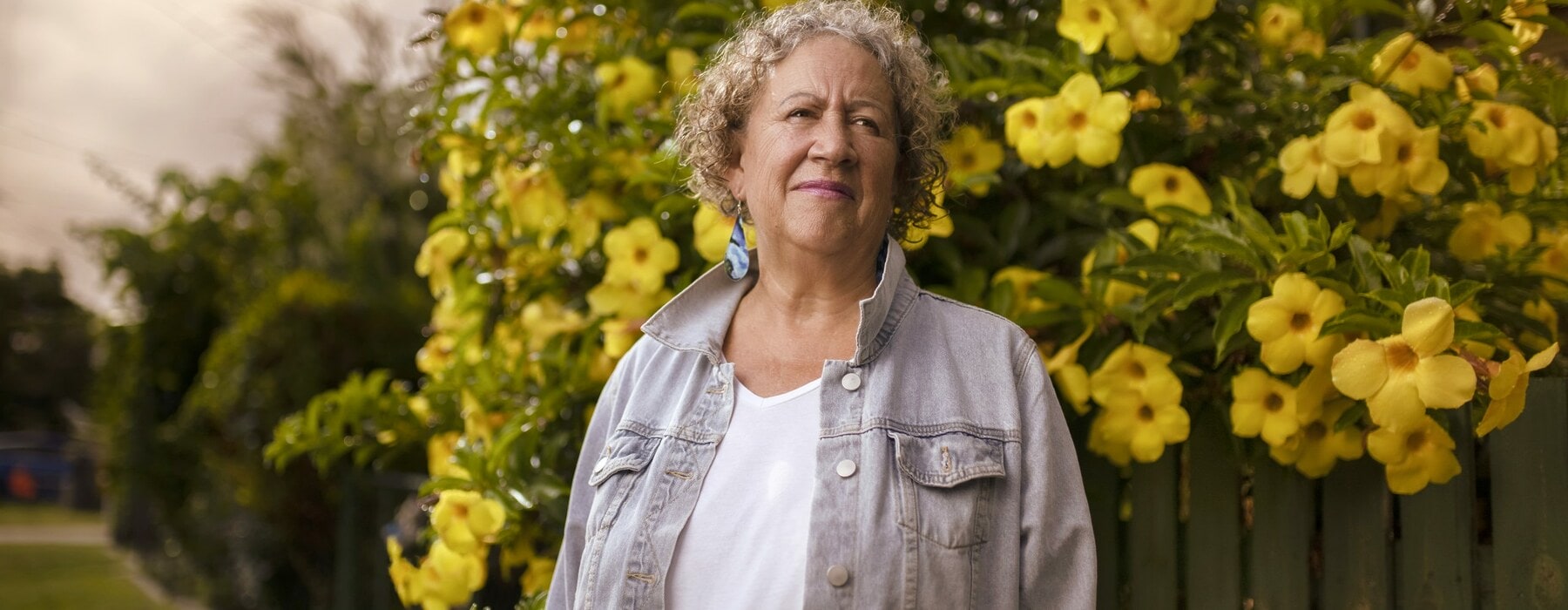 Sharon Armstrong standing by yellow tree
