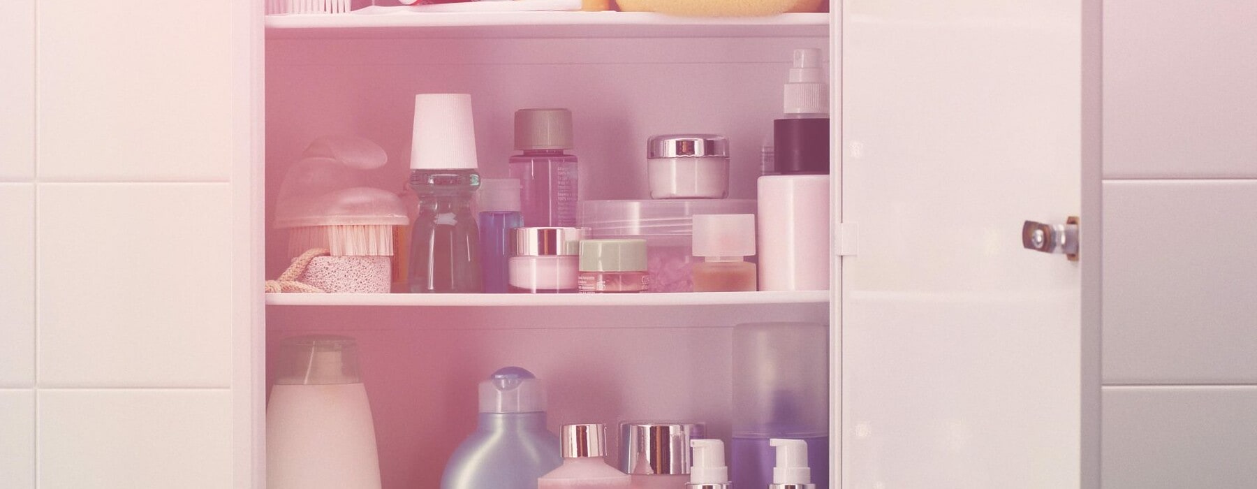 An open cabinet full of beauty products.