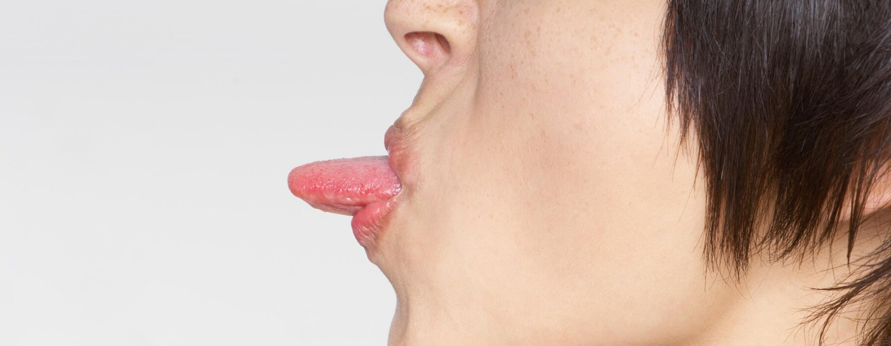 Woman sticking out tongue
