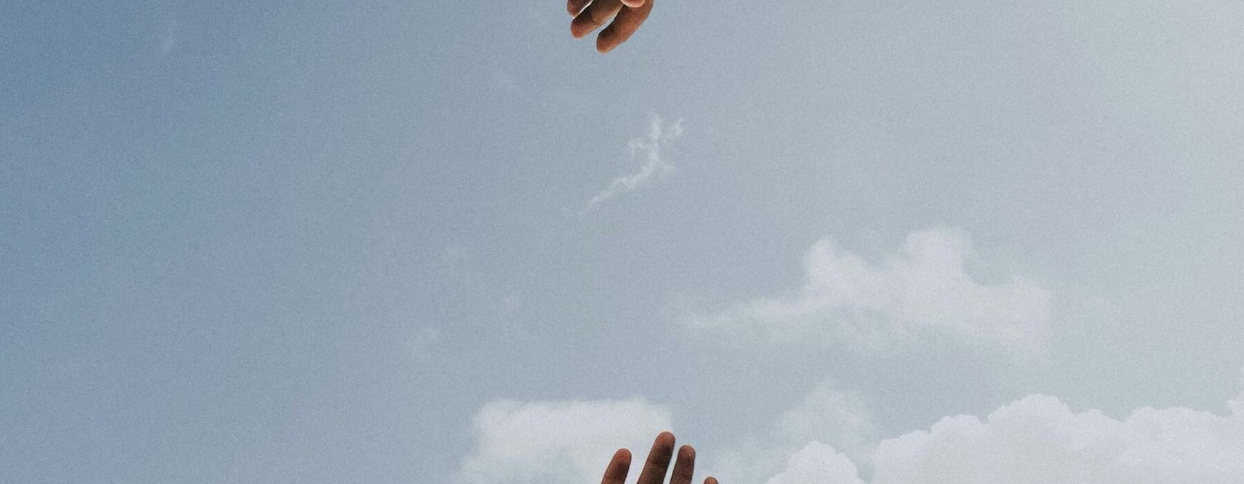 Hands reaching for each other