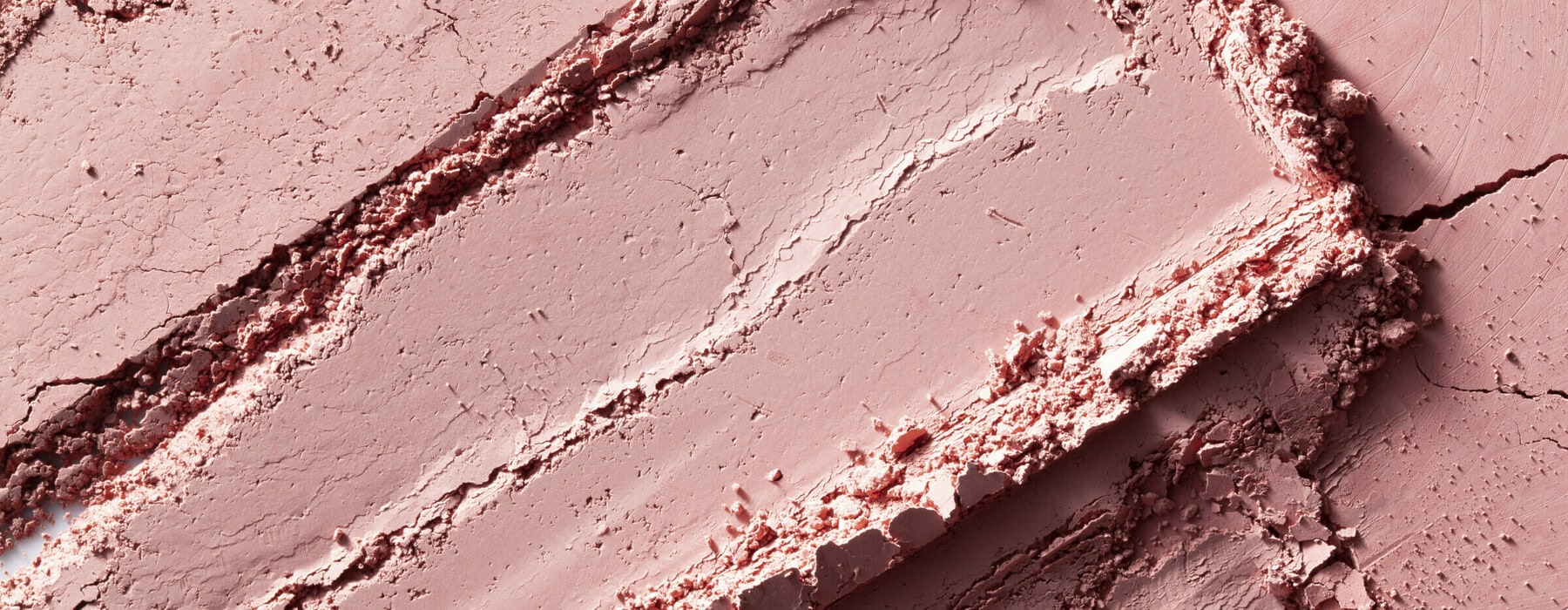 Crushed pink eyeshadow. Close-up photography.