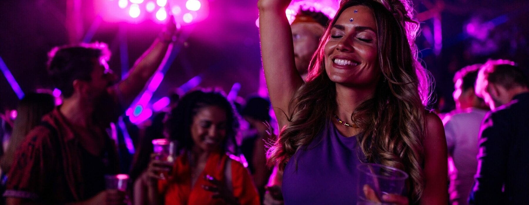 A,Young,Caucasian,Woman,Is,Dancing,At,A,Concert,Having