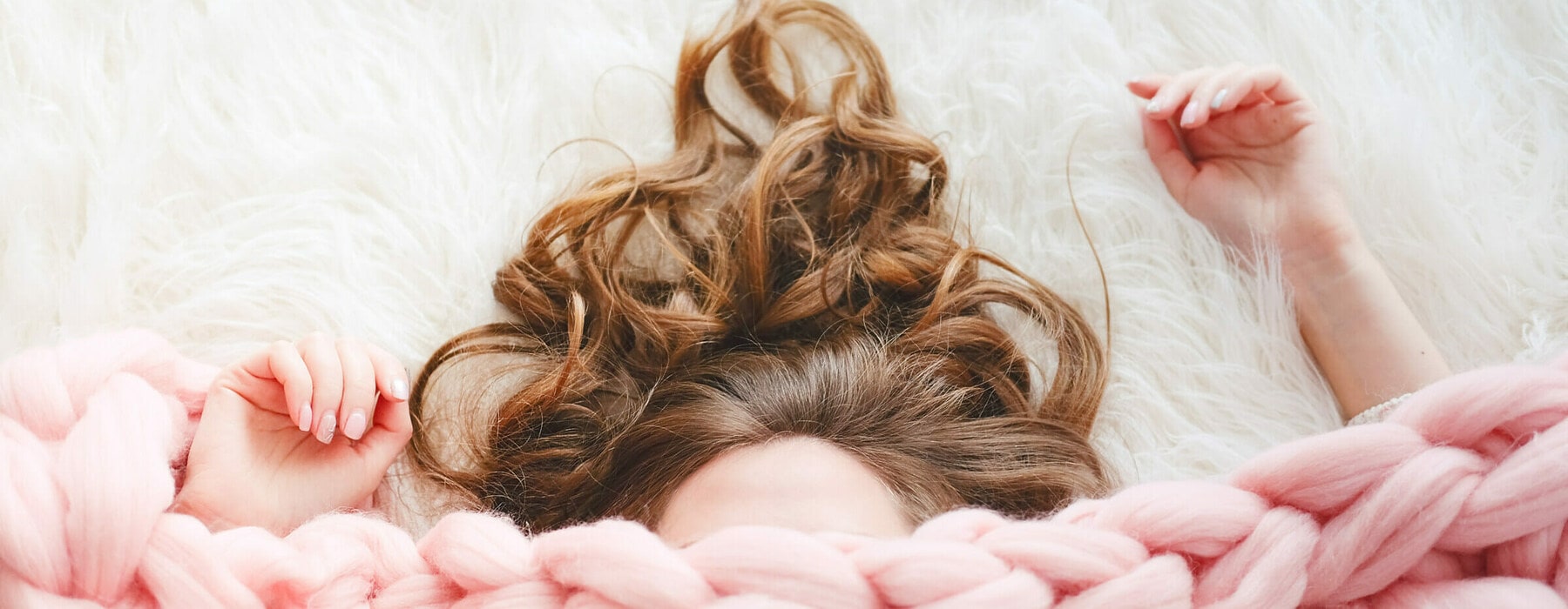 Young,Woman,With,Long,Brown,Hair,Sleeping,Under,Warm,Knitted